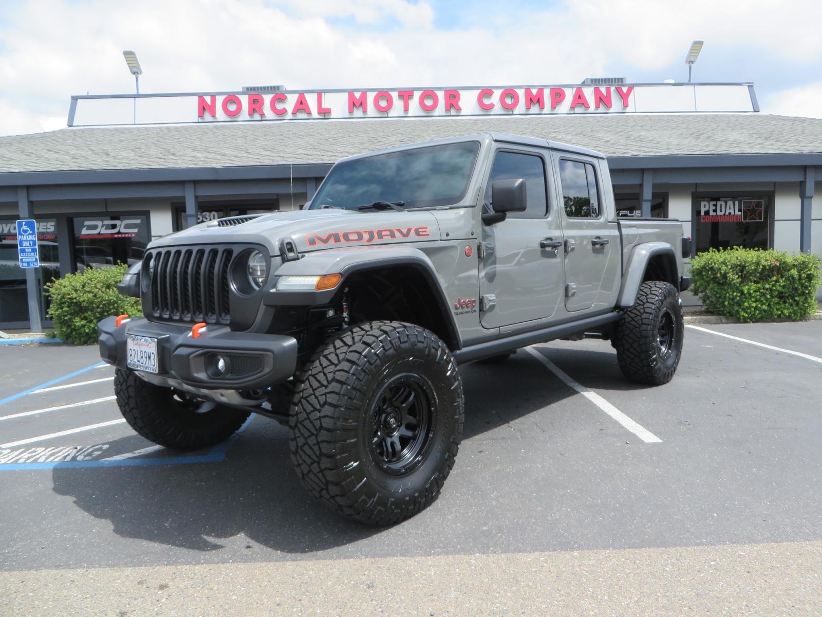 2021 Sting Grey /BLACK Jeep Gladiator Gladiator Mojave (1C6JJTEG4ML) with an 3.6L V6 engine, automatic transmission, located at 2630 Grass Valley Highway, Auburn, CA, 95603, (530) 508-5100, 38.937893, -121.095482 - Mojave Galdiator featuring a Readylift 4" suspension system, 37" Nitto Ridge Grappler tires, 17" Fuel Ammo wheels, Rugged Ridge bed cover, and window tint. - Photo #0